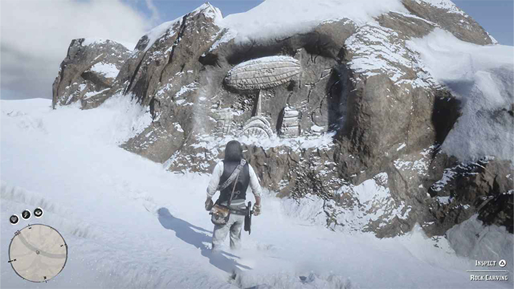 اسکرین&zwnj;شات گیم&zwnj;پلی RDR2 از حکاکی روی سنگ به شکل کشتی هوایی در کوهستان برفی مونت هاگ